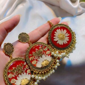 Orange and white resin jhumky and Bindia